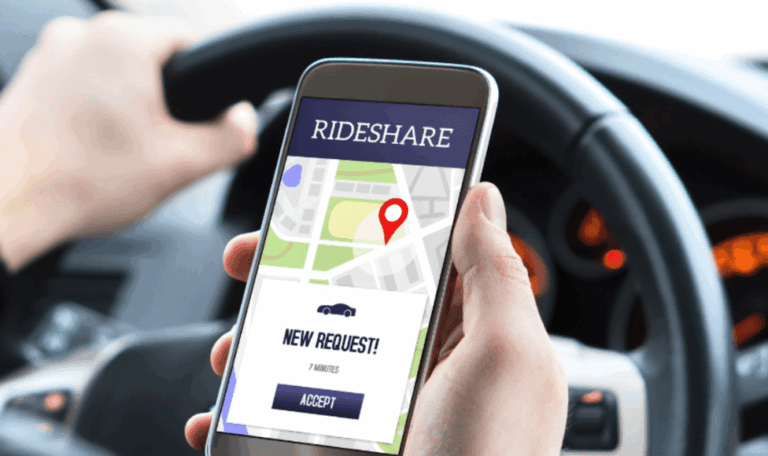 Close-up of a driver holding a smartphone with a rideshare app showing a new ride request, representing Uber and Lyft accident claims in Connecticut